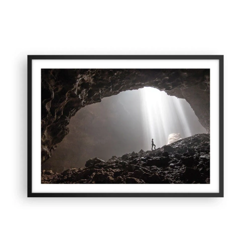 Poster in cornice nera - Una figura in una grotta illuminata da raggi di luce - 70x50cm - Grotta luminosa - Decorazione murale moderna per soggiorno e camera da letto ARTTOR