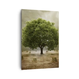 Quadro su tela - Stampe su Tela - Un albero verde circondato da tronchi d'albero abbattuti contro un cielo nuvoloso - 70x100cm - Ogni speranza - Decorazione murale moderna per soggiorno e camera da letto ARTTOR
