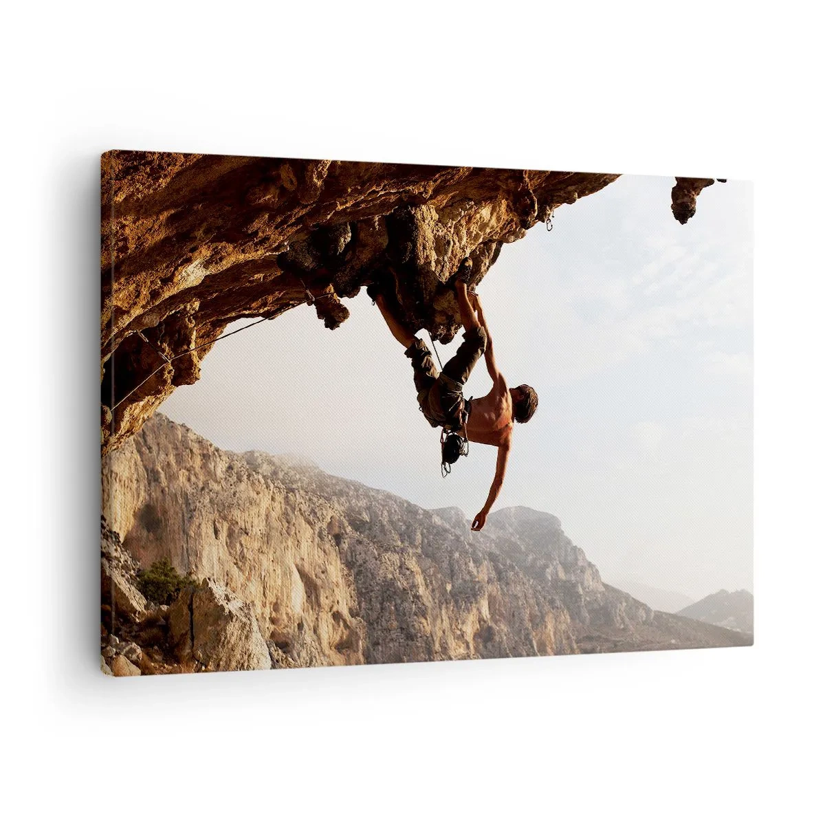 Quadro su tela - Stampe su Tela - Uno scalatore su una ripida scogliera in montagna sotto il sole - 70x50cm - Il mondo ristretto in una mano sul bordo del masso - Decorazione murale moderna per soggiorno e camera da letto ARTTOR