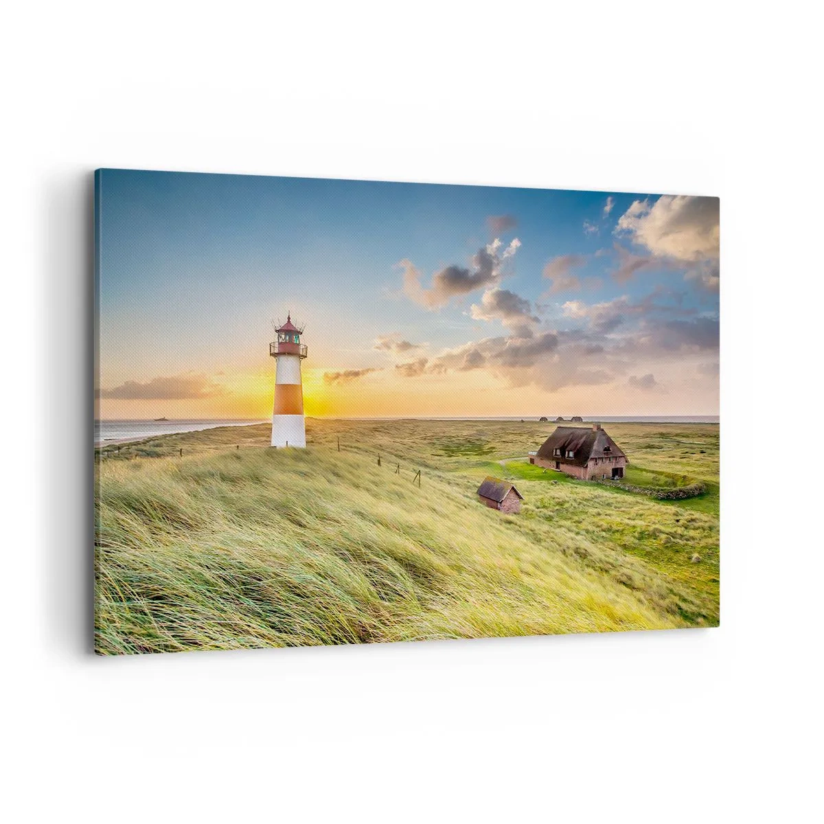 Quadro su tela - Stampe su Tela - Un faro con prati e case al sole sullo sfondo - 100x70cm - Tra le onde - Decorazione murale moderna per soggiorno e camera da letto ARTTOR