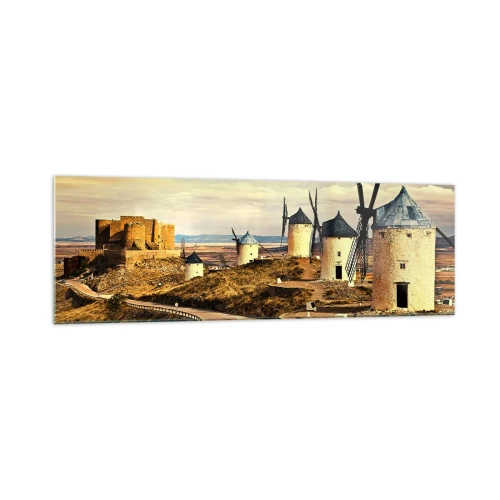 Quadro su vetro - Mulini a vento sulle colline con un castello storico sullo sfondo - 160x50cm - Adesso appare Don Chisciotte - Decorazione murale moderna per soggiorno e camera da letto ARTTOR