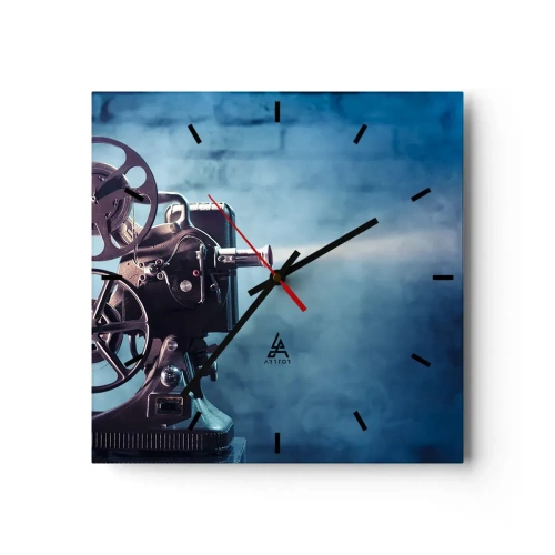 Orologio da parete - Orologio in Vetro - Un vecchio proiettore cinematografico proietta luce su uno sfondo blu - 30x30cm - Nel vecchio cinema - Decorazione murale moderna per soggiorno e camera da letto ARTTOR