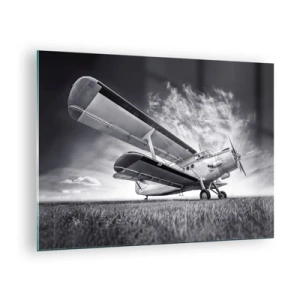 Quadro su vetro - Una fotografia in bianco e nero di un aereo contro un cielo spettacolare. - 70x50cm - Giramondo alato  - Decorazione murale moderna per soggiorno e camera da letto ARTTOR