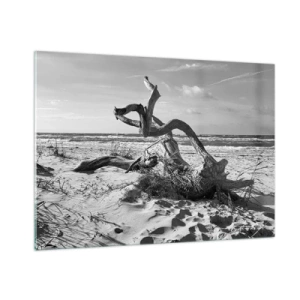 Quadro su vetro - Un paesaggio in bianco e nero con un ramo caduto su una spiaggia in riva al mare. - 100x70cm - Scolpito dal mare - Decorazione murale moderna per soggiorno e camera da letto ARTTOR