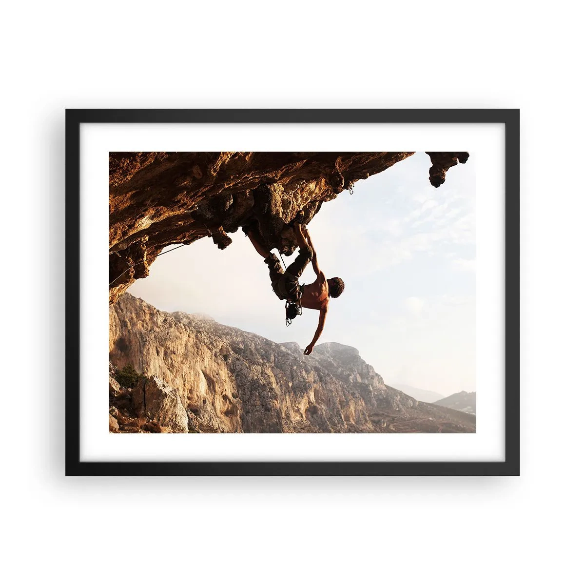 Poster in cornice nera - Il mondo ristretto in una mano sul bordo del masso - 50x40 cm