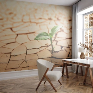 Fotomurali Premium Canvas - Una pianta verde che cresce nella terra secca e screpolata - 100x70cm - L'indomita forza della vita - Decorazione murale moderna per soggiorno e camera da letto ARTTOR