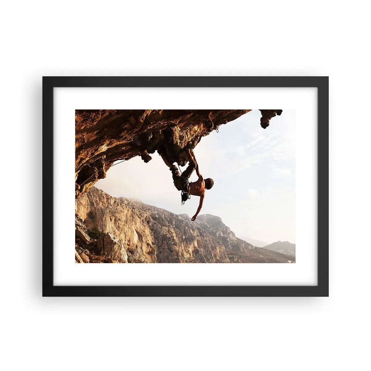 Poster in cornice nera - Il mondo ristretto in una mano sul bordo del masso - 40x30 cm