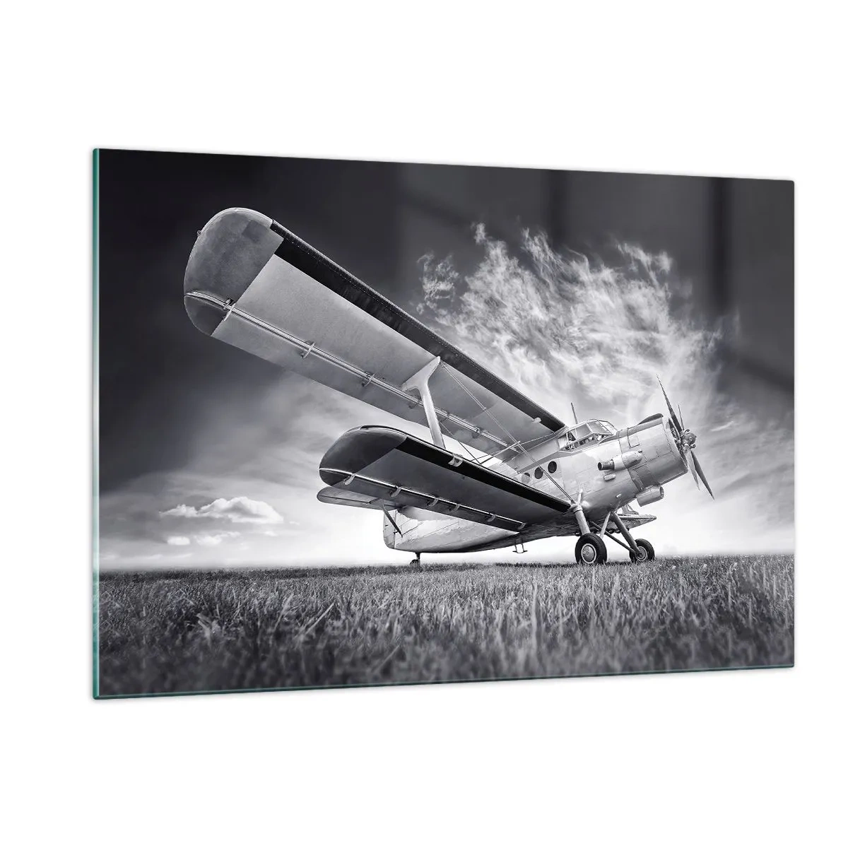 Quadro su vetro - Una fotografia in bianco e nero di un aereo contro un cielo spettacolare. - 120x80cm - Giramondo alato  - Decorazione murale moderna per soggiorno e camera da letto ARTTOR