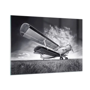 Quadro su vetro - Una fotografia in bianco e nero di un aereo contro un cielo spettacolare. - 100x70cm - Giramondo alato  - Decorazione murale moderna per soggiorno e camera da letto ARTTOR