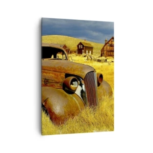 Quadro su tela - Stampe su Tela - Una vecchia macchina arrugginita sullo sfondo di capanne di legno abbandonate - 70x100cm - Meritato riposo - Decorazione murale moderna per soggiorno e camera da letto ARTTOR