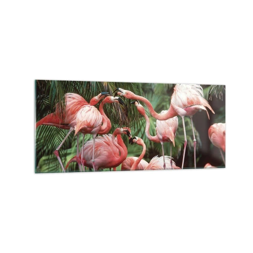 Quadro su vetro - Un gruppo di fenicotteri in un ambiente tropicale circondato da palme - 120x50cm - Pettegolezzi pomeridiani - Decorazione murale moderna per soggiorno e camera da letto ARTTOR