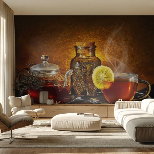 Fotomurali Premium Sand - Una brocca di vetro e una tazza di tè al limone su uno sfondo dorato. - 100x70cm - Nello stile dei maestri olandesi - Decorazione murale moderna per soggiorno e camera da letto ARTTOR