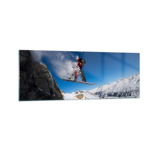 Quadro su vetro - Uno snowboarder salta da una roccia contro un paesaggio montano - 140x50cm - E diventi parte del panorama - Decorazione murale moderna per soggiorno e camera da letto ARTTOR