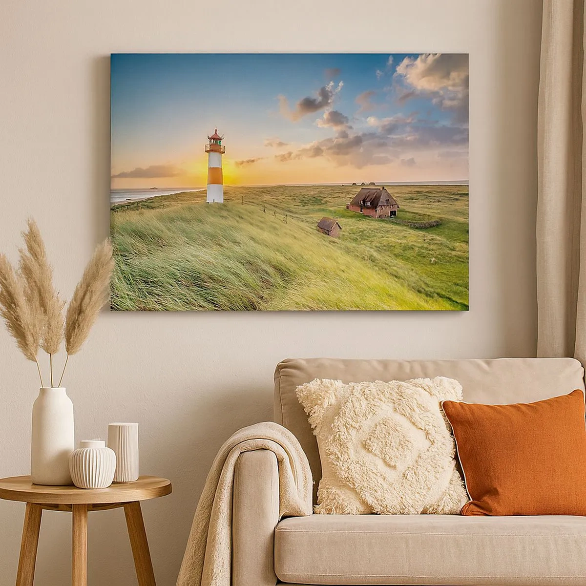 Quadro su tela - Stampe su Tela - Un faro con prati e case al sole sullo sfondo - 70x50cm - Tra le onde - Decorazione murale moderna per soggiorno e camera da letto ARTTOR