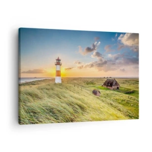 Quadro su tela - Stampe su Tela - Un faro con prati e case al sole sullo sfondo - 70x50cm - Tra le onde - Decorazione murale moderna per soggiorno e camera da letto ARTTOR