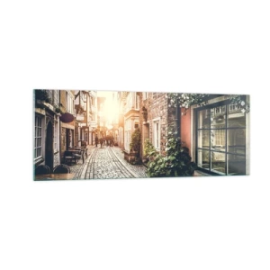 Quadro su vetro - Una strada affascinante con pavimentazione in pietra e fiori - 140x50cm - L'angolo delle rose nella luce rosata - Decorazione murale moderna per soggiorno e camera da letto ARTTOR
