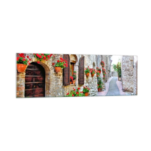 Quadro su vetro - Una strada stretta con edifici in pietra decorati con vasi di fiori - 160x50cm - Atmosfera italiana - Decorazione murale moderna per soggiorno e camera da letto ARTTOR