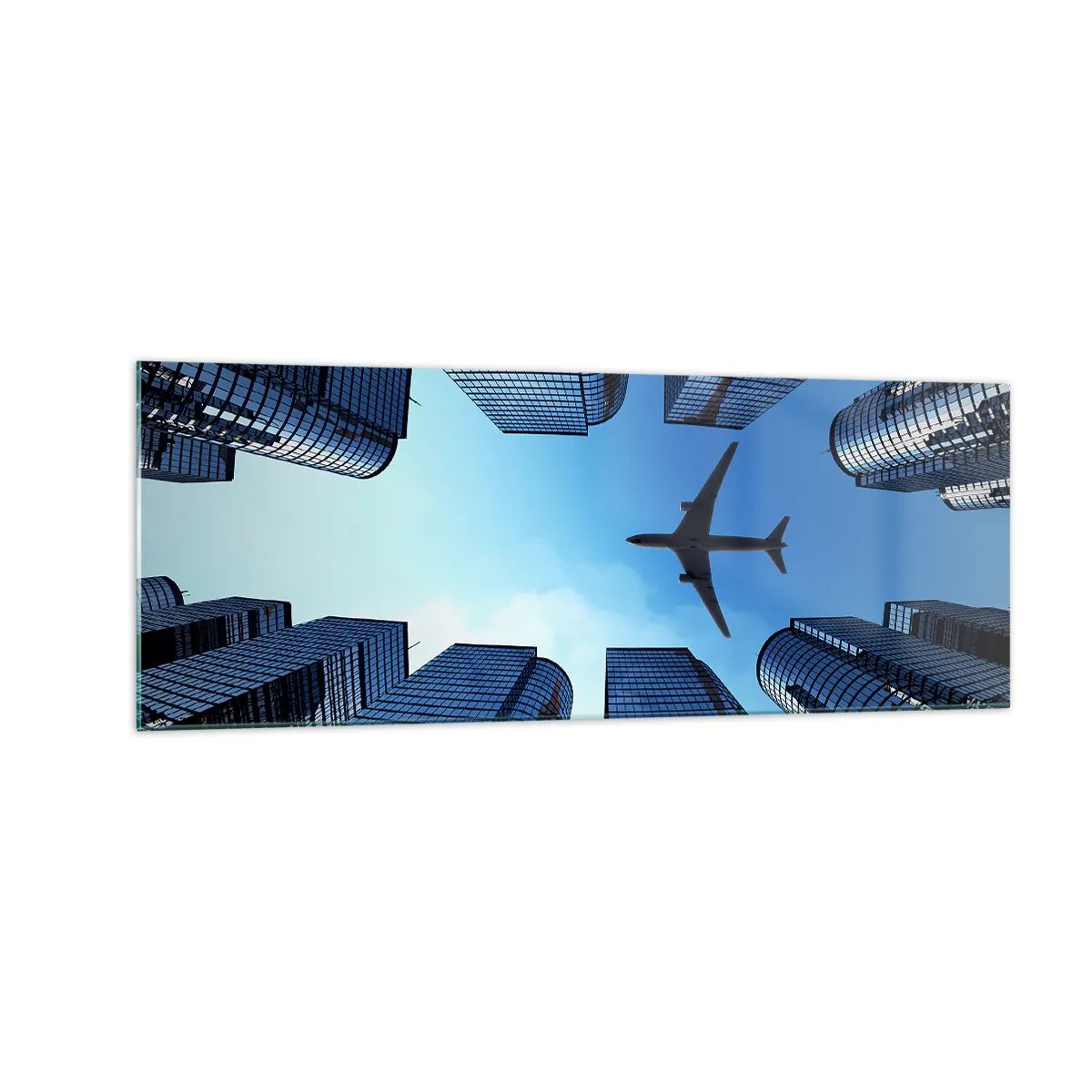 Quadro su vetro - Un aereo che sorvola i moderni grattacieli del centro città. - 140x50cm - Panorama dal canyon di vetro - Decorazione murale moderna per soggiorno e camera da letto ARTTOR