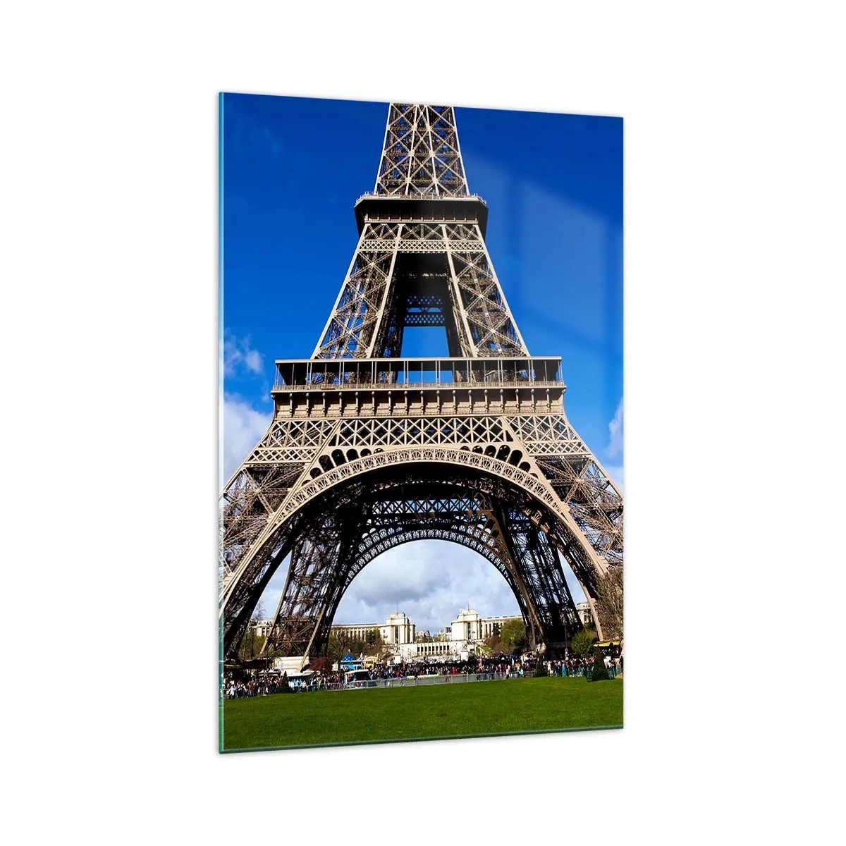 Quadro su vetro - La Torre Eiffel sullo sfondo di un cielo azzurro e di un parco verde - 70x100cm - Tutta Parigi ai suoi piedi - Decorazione murale moderna per soggiorno e camera da letto ARTTOR