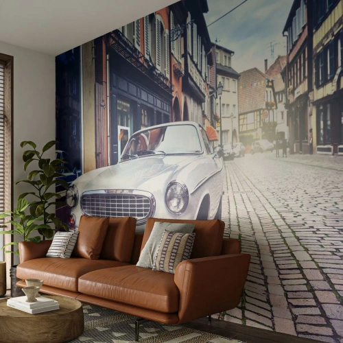 Fotomurali Premium Canvas - Una classica auto bianca su una strada cittadina acciottolata - 100x70cm - Il passato è oggi - Decorazione murale moderna per soggiorno e camera da letto ARTTOR
