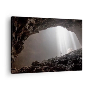 Quadro su tela - Stampe su Tela - Una figura in una grotta illuminata da raggi di luce - 70x50cm - Grotta luminosa - Decorazione murale moderna per soggiorno e camera da letto ARTTOR
