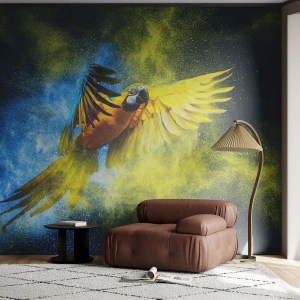 Fotomurali Premium Canvas - Un pappagallo in volo sullo sfondo di esplosioni colorate di giallo e blu. - 100x70cm - Nella polvere gialla e blu - Decorazione murale moderna per soggiorno e camera da letto ARTTOR