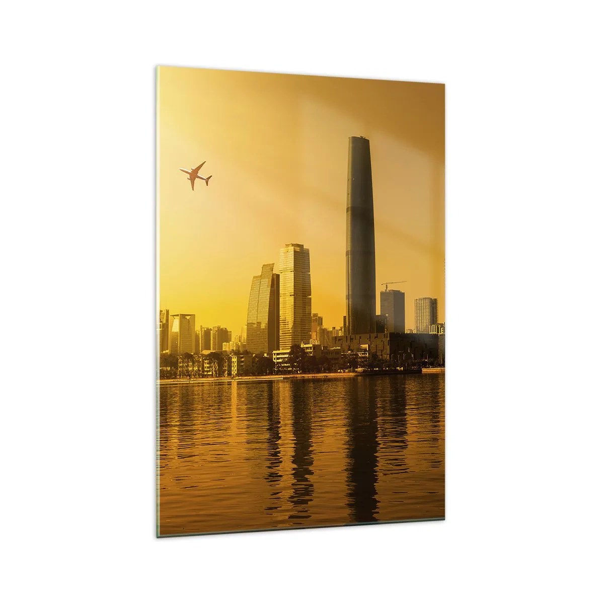 Quadro su vetro - Panorama della città al tramonto con grattacieli e un aereo - 70x100cm - Città d'oro - Decorazione murale moderna per soggiorno e camera da letto ARTTOR
