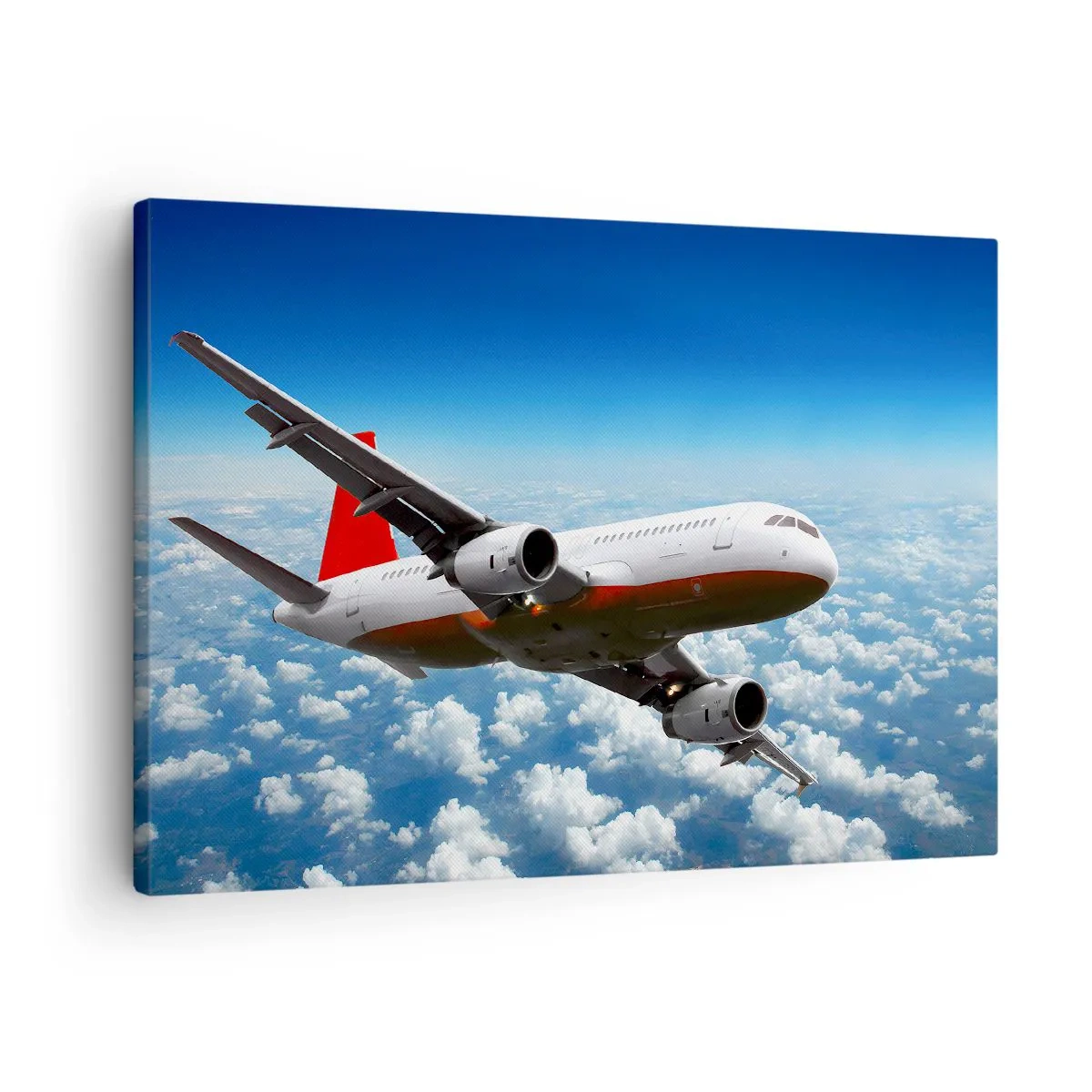 Quadro su tela - Stampe su Tela - Un aereo passeggeri vola sopra le nuvole contro un cielo azzurro. - 70x50cm - Lascia tutto - Decorazione murale moderna per soggiorno e camera da letto ARTTOR