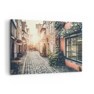 Quadro su tela - Stampe su Tela - Una strada affascinante con pavimentazione in pietra e fiori - 100x70cm - L'angolo delle rose nella luce rosata - Decorazione murale moderna per soggiorno e camera da letto ARTTOR