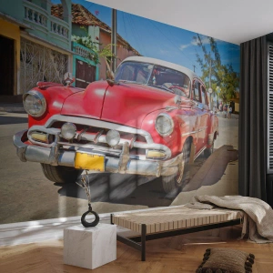 Fotomurali Premium Sand - Una classica auto rossa sulla strada di una città storica - 100x70cm - Ancora solamente a Cuba - Decorazione murale moderna per soggiorno e camera da letto ARTTOR
