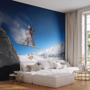 Fotomurali Premium Sand - Uno snowboarder salta sullo sfondo di montagne innevate. - 100x70cm - E diventi parte del panorama - Decorazione murale moderna per soggiorno e camera da letto ARTTOR