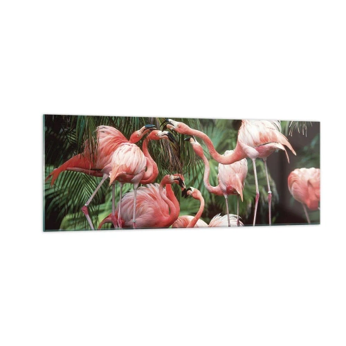 Quadro su vetro - Un gruppo di fenicotteri in un ambiente tropicale circondato da palme - 140x50cm - Pettegolezzi pomeridiani - Decorazione murale moderna per soggiorno e camera da letto ARTTOR