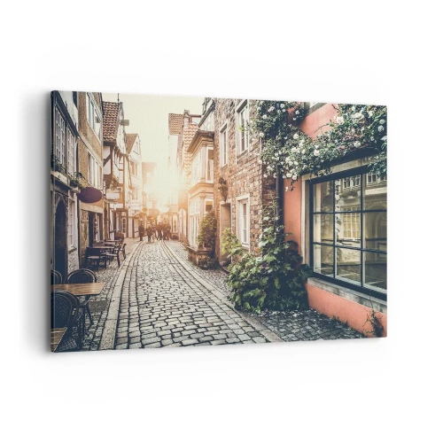 Quadro su tela - Stampe su Tela - Una strada affascinante con pavimentazione in pietra e fiori - 100x70cm - L'angolo delle rose nella luce rosata - Decorazione murale moderna per soggiorno e camera da letto ARTTOR