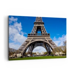 Quadro su tela - Stampe su Tela - La Torre Eiffel sullo sfondo di un cielo azzurro e di un parco verde - 100x70cm - Tutta Parigi ai suoi piedi - Decorazione murale moderna per soggiorno e camera da letto ARTTOR