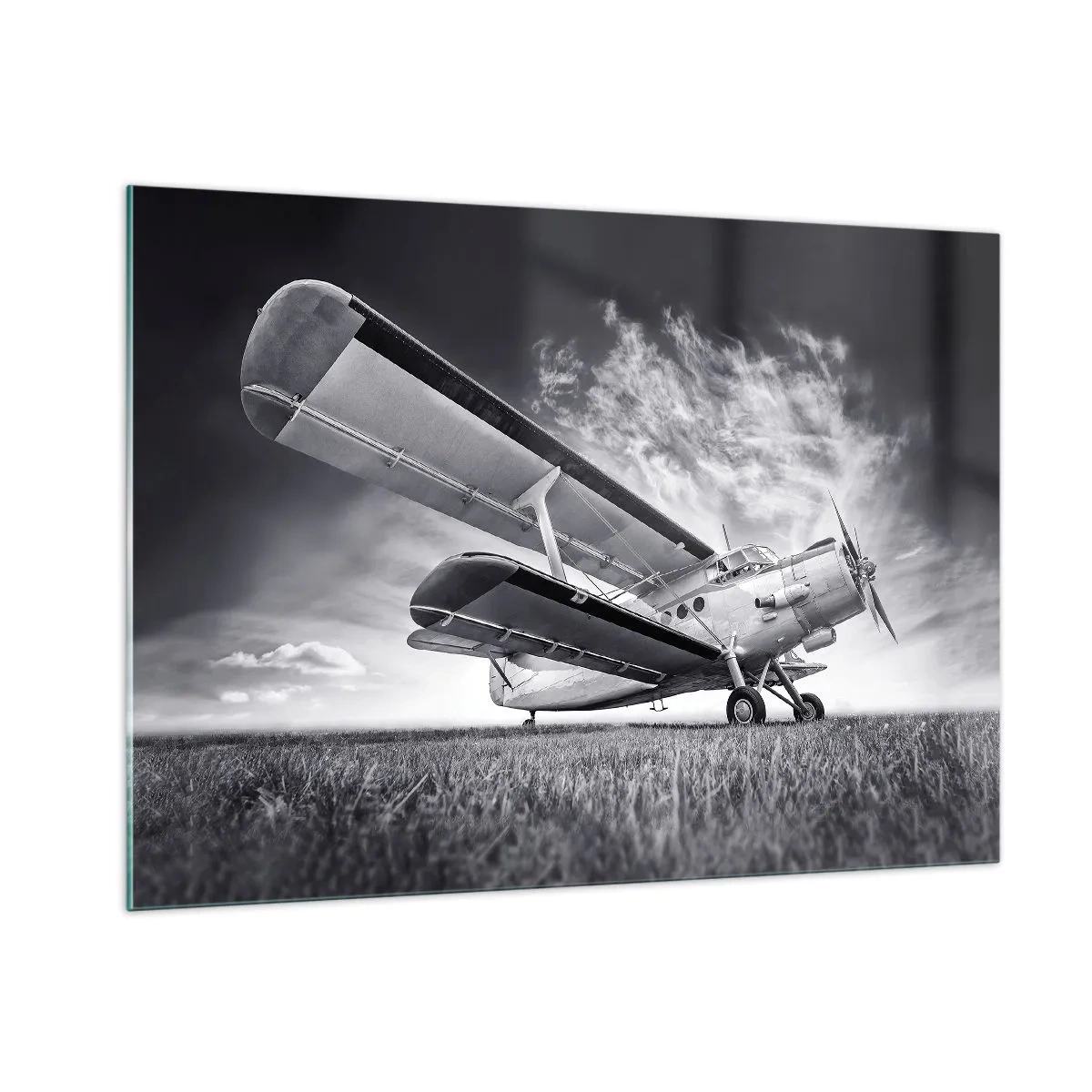 Quadro su vetro - Una fotografia in bianco e nero di un aereo contro un cielo spettacolare. - 100x70cm - Giramondo alato  - Decorazione murale moderna per soggiorno e camera da letto ARTTOR