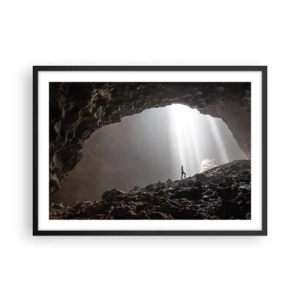 Poster in cornice nera - Una figura in una grotta illuminata da raggi di luce - 70x50cm - Grotta luminosa - Decorazione murale moderna per soggiorno e camera da letto ARTTOR