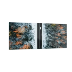 Quadro su vetro - Tagliando la foresta invernale - 100x40 cm