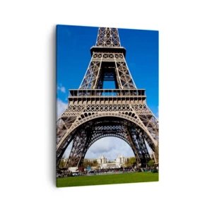 Quadro su tela - Stampe su Tela - La Torre Eiffel sullo sfondo di un cielo azzurro e di un parco verde - 50x70cm - Tutta Parigi ai suoi piedi - Decorazione murale moderna per soggiorno e camera da letto ARTTOR