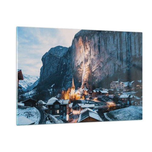 Quadro su vetro - Un villaggio invernale ai piedi di una parete rocciosa illuminata - 120x80cm - Lo spirito luminoso dell'inverno - Decorazione murale moderna per soggiorno e camera da letto ARTTOR
