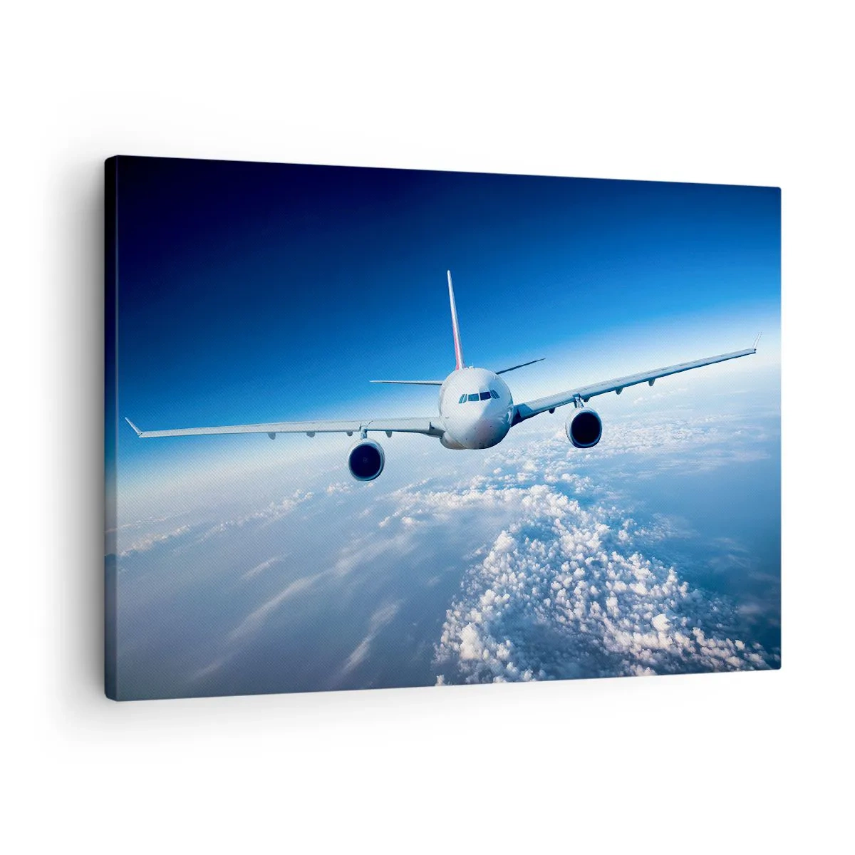 Quadro su tela - Stampe su Tela - Un aereo che vola sopra le nuvole contro un cielo blu - 70x50cm - Voglia di volare - Decorazione murale moderna per soggiorno e camera da letto ARTTOR