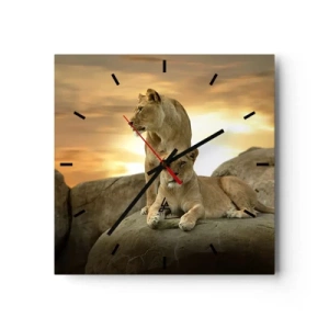 Orologio da parete - Orologio in Vetro - Due leonesse riposano su una roccia durante il tramonto - 30x30cm - Maestà reale - Decorazione murale moderna per soggiorno e camera da letto ARTTOR